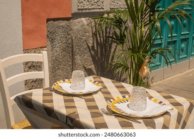 table setting at the restaurant serving for two people, branch and dinner in Italy