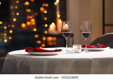 Table setting for romantic dinner in restaurant - Shutterstock ID 1922124695