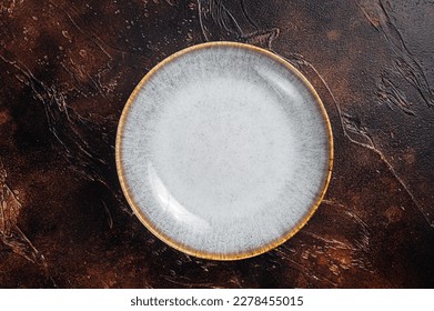 Table setting with vintage empty white plate on rustic wood. Dark background. Top view. Copy space. - Powered by Shutterstock - Get 15% off with code: PIKWIZARD15
