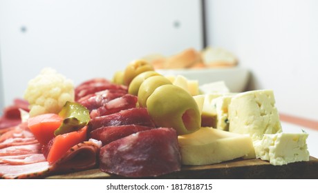 A Table Of Sliced Meats For Dinner On A Friday Night