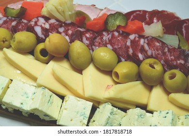 A Table Of Sliced Meats For Dinner On A Friday Night