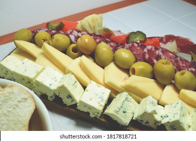 A Table Of Sliced Meats For Dinner On A Friday Night