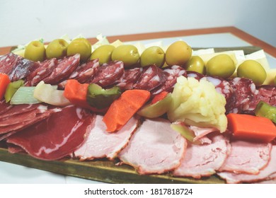 A Table Of Sliced Meats For Dinner On A Friday Night