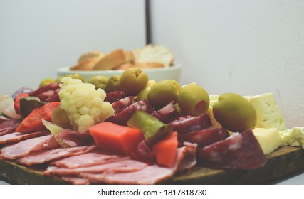 A Table Of Sliced Meats For Dinner On A Friday Night