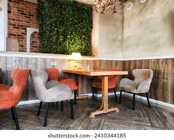 A table in a small cozy cafe or restaurant with window and curtains. Dimmed lights, beautiful Design of the hall. Nobody to a place to relax and eat - Powered by Shutterstock