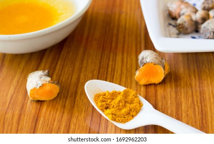 A Table Spoon Of Pure Turmeric Haldi Spices Powder, Oil And Water. Haldi Ceremony Or Pre-wedding Or First Wedding Ritual In Morning. Indian Marriage Traditions Background. India South Asia Pacific