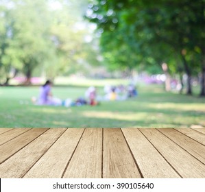 Table And Summer Park Background, Blur Family Picnic At Outside Green Tree Garden Background, Empty Perspective Wood Table Top Over Blur People At Nature Park In Spring, Summer Backdrop, Banner 