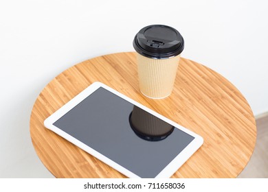 table with tablet and coffee
