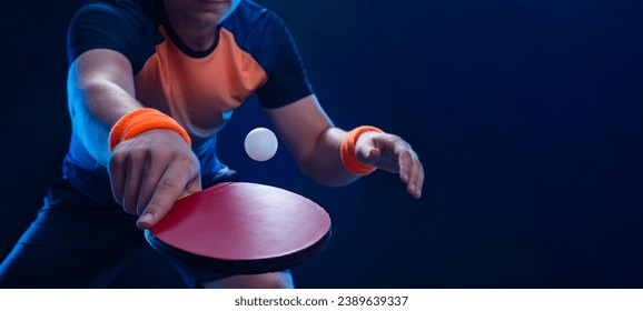 Table tennis player in action close-up photo. Ping pong horizontal banner. Download a photo of a table tennis player for a tenis racket packaging design. Image for tennis ball box template.