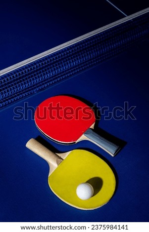 table tennis racket On the blue ping pong table
