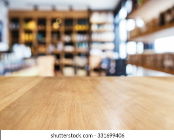 Table Top Counter With Blur Shelf Display Interior Of Retail Shop Background