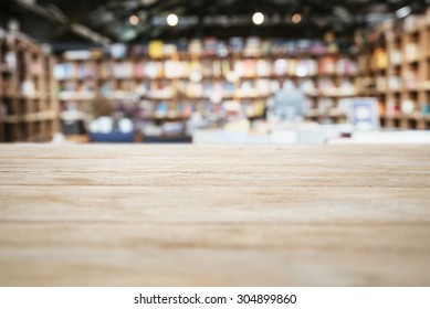 Table Top Counter With Blurred Bookshelf Bookstore Background