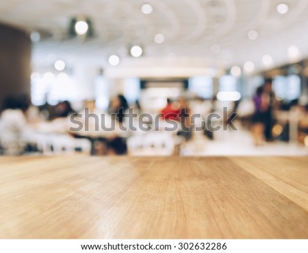 Table top Counter with Blurred People and Restaurant Shop interior background