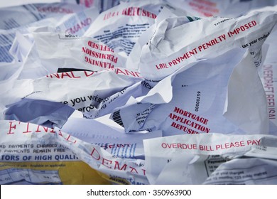 A Table Top Covered In Final Demands, Refusals And Debt Collection Letters