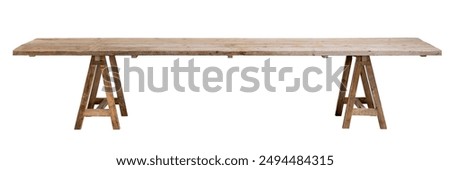 table with top in rough boards, on trestles. Isolated white background