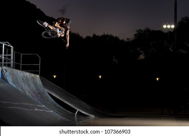 Table top in a skatepark, bmx bike trick on a quarter pipe - Powered by Shutterstock