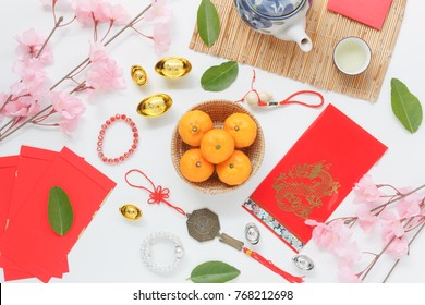 Table Top View Aerial Of Accessories And Chinese New Year And Lunar New Year Festival Concept Background.Difference Items On  White Wood At Office Desk.Other Language Mean Rich Or Wealthy And Happy.