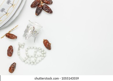 Table Top View Aerial Image Of Decoration Ramadan Kareem Holiday Background.Flat Lay Date With Rosary & Lighting.The Hat On Modern Rustic White Wooden At Office Desk.Negative Space Creative Design.