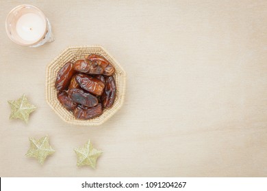 Table Top View Aerial Image Of Decoration Ramadan Kareem Holiday Background.Flat Lay Date In Wood Basket With Gold Star & Lantern On Modern Rustic Brown Wooden At Office Desk.Space For Creative Design