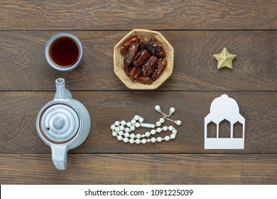 Table Top View Aerial Image Of Decoration Ramadan Kareem Holiday Background.Flat Lay Date In Wood Basket With White Rosary & Aromatherapy Candle .Essential Object Star On Rustic Wooden At Office Desk.