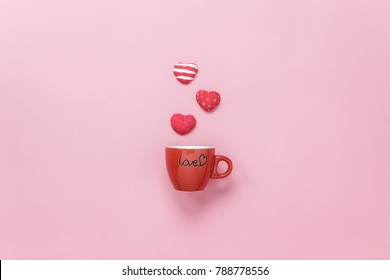 Table Top View Aerial Image Of Sign Valentine's Day Background Concept.Flat Lay Arrangement Red Coffee Cup With Steam Heart Shape On Modern Pink Paper At Home Office Desk Studio.Pastel Tone Design.