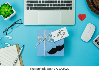 Table Top View Happy Fathers Day Holiday & Office Desk Background Concept.Flat Lay Gift Box For Dad With Accessories Objects Work From Home The Laptop,notebook,tree Pot,calculator,notepad,hat,love.