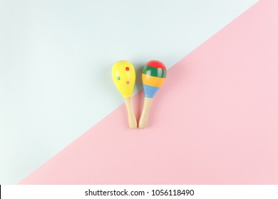 Table Top View Kids Toys For Develop Background Concept.Flat Lay Objects The Colorful Wooden Ball Percussion Musical Instruments On Modern Duo Paper Blue & Pink At Office Desk.Design Pastel Tone.