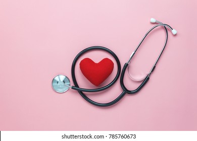 Table top view shot of arrangement equipment medical background concept.Red heart & stethoscope on modern rustic pink paper.An idea essential accessories for doctor for  care patient  in hospital. - Powered by Shutterstock