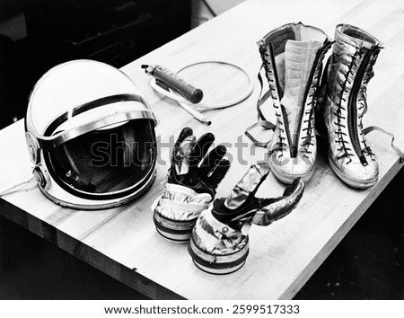 Table top view of some of the Mercury suit components including gloves, boots and helmet. USA - May 1st, 1961.