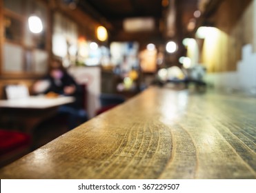 Table Top Wooden Counter Blur Bar Restaurant Interior With People Background 