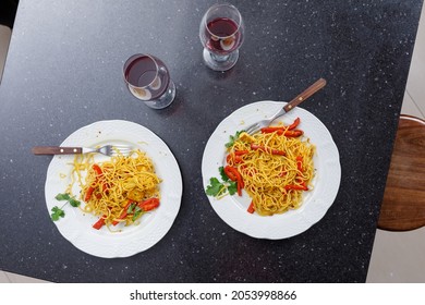 Table With Two Plates Of Pasta, A Couple Of Glasses Of Red Wine. Vegan Food. Romantic Couple Dinner Concept. No People.