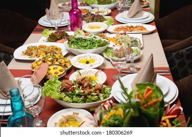 Table With Various Arabic Food Served 