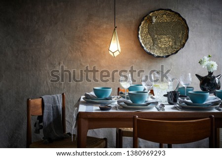 Table with table ware and lighting