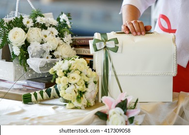 A Table For Wedding Presents Decorated With Bouquets Of Roses