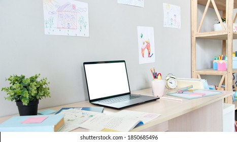 Table With White Blank Mock Up Computer Screen For Online Virtual Social Distance Remote Learning. School Child Home Desk Interior With Books And Laptop Mockup Monitor For Elearning Ads Concept.