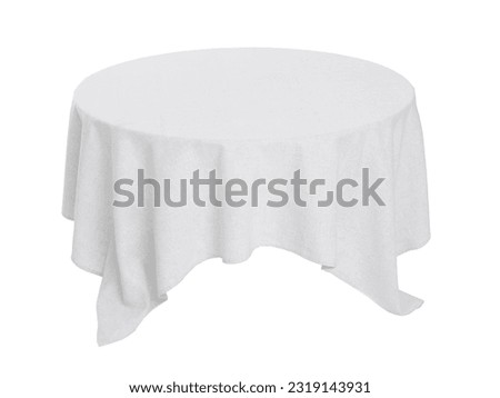 Table with white tablecloth isolated on white