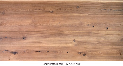 Table Wooden Surface From Natural Oak. Rich Wood Grain Texture Background With Knots And Strong Lines. Copy Space