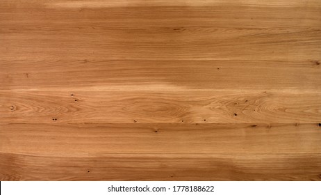 Table Wooden Surface From Natural Oak. Rich Wood Grain Texture Background With Knots And Strong Lines. Copy Space