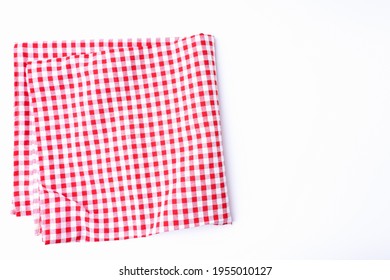 The tablecloth checkered red and white fabric cotton folded place on a white table with copy space. Background for designing food and beverage menus in restaurants. - Powered by Shutterstock