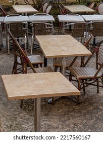 Tables And Chairs In A Cobbled Street For Drinking And Dining Outside