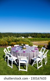 Tables, Chairs, Decor, And Decorations At A Wedding Reception At An Outdoor Venue Vineyard Winery In Oregon.