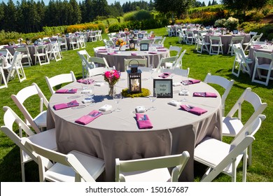 Tables, chairs, decor, and decorations at a wedding reception at an outdoor venue vineyard winery in oregon.