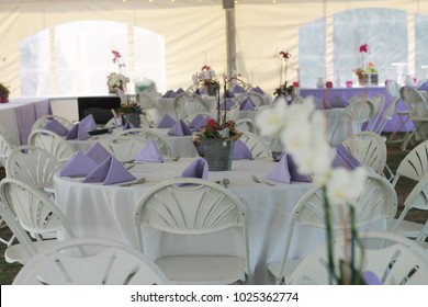 Tables And Chairs At An Outdoor Dinner Event. 