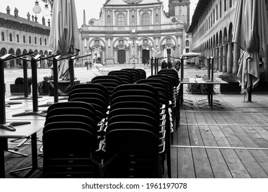 Tables And Chairs In An Outdoor Restaurant In Vigevano (Lombardy, Northern Italy), During Covid Closure.