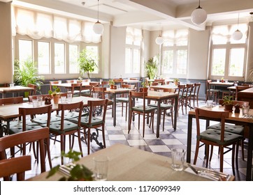 Tables Laid For Service In Empty Restaurant