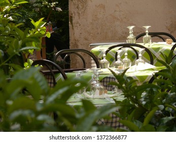 Tables Set For Lunch In A Typical Italian Tavern