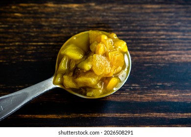 Tablespoon Of Canned Hatch Green Peppers: A Measuring Spoon Filled With Diced Green New Mexico Chili Peppers