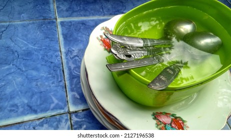 Tablespoon, In A Green Place. And A Blue Background With A Little Water