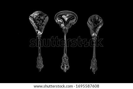 tablespoons on a dark background. the view from the top