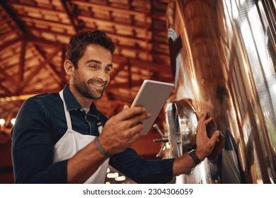 Tablet, beer and storage with man in factory for production, manufacturing and alcohol fermentation. Technology, inspection and digital with business owner for distillery, brewery and quality control - Powered by Shutterstock